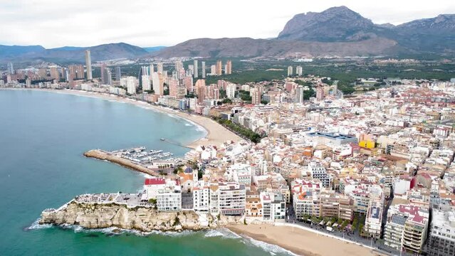 Aerial perspective of Benidorm city center. View of Benidorm Marina and Poniente Beach area with beautiful skyscrapers.  Drone rotating right creating a beautiful panorama of the city. 