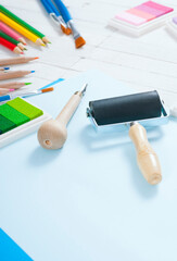 creative hobby tools on white wood