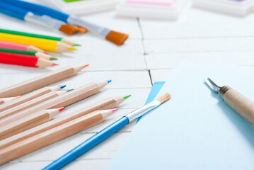 creative hobby tools on white wood