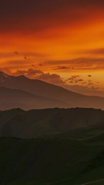 Beautiful sunset in the smoky mountains, Caucasus, Russia, timelapse. Vertical video