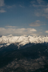 Snowy mountains. Sunny winter day. Amazing snow covered peaks in the Sochi, Russia.