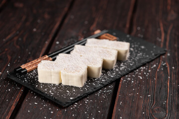 Asian dessert maki sushi - Roll with fruits and cream cheese with coconut flakes