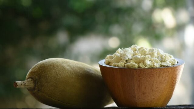 Baobab pulp and fruit on nature background.