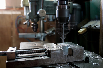 Part machining with drilling machine