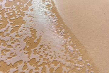 sand and water at beach in hawaii