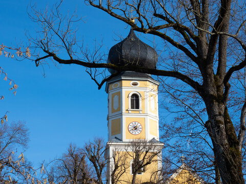 Bernried, Germany - December 30th 2022: Beautiful yellow church tower of the monastery.