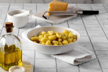 Italian gnocchi on a minimalist light kitchen table
