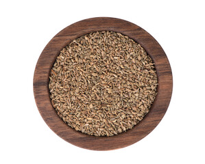Brown Organic Ajwain Seed in a wood Bowl on a white Background. Ajowan seed. 