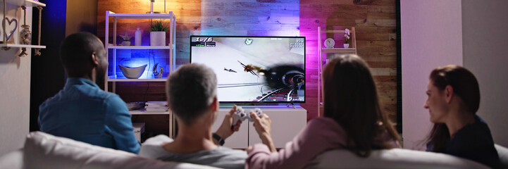 Rear View Of An People Playing Video Games © Andrey Popov