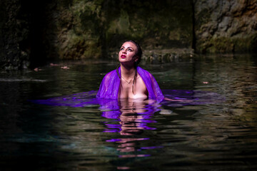 A Lovely Nude Latin Model Enjoys The Beautiful Waters In The Cenotes Near Cuzama, Yucatan, Mexico