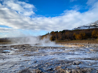 Geysir (The Great Geysir) geyser in southwestern Iceland. Geysir in Haukadalur valley on the slopes of Laugarfjall hill, which is also the home to Strokkur geyser.