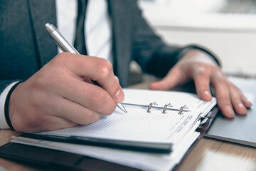 Man taking notes in a notebook