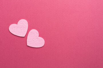 Obraz premium Felt hearts on color background, top view