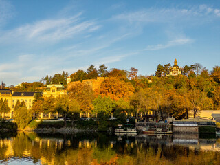 Colors of autumn Prague. Picturesque autumn colors on the embankment by the Vltava river, Prague, Czech Republic