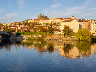 Obraz na płótnie Canvas Colors of autumn Prague. Picturesque autumn colors on the embankment by the Vltava river, Prague, Czech Republic