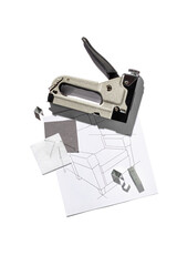 Silver furniture stapler gun with staples and the drawing of the armchair isolated on white background. Manual industrial tool