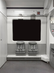 Two cycle seats train interior without passengers and black window