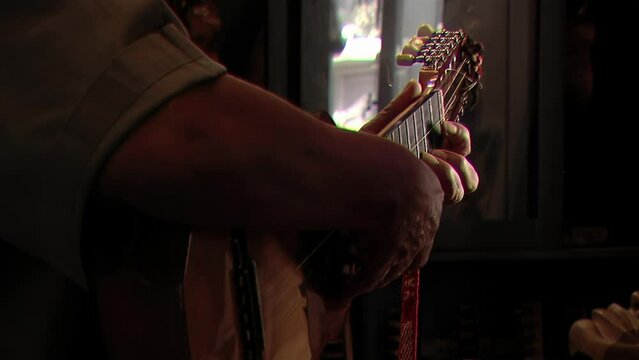 Man Playing a "Charango", Small Andean Stringed Instrument, Jujuy, Argentina. Close Up.