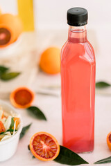 various salad vinegars in glass bottles. Front and top view. apple, lemon, strawberry, quince, grape, melon, apricot, tangerine, orange, grapefruit,