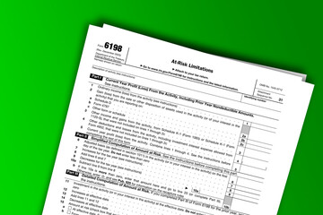 Form 6198 documentation published IRS USA 43902. American tax document on colored