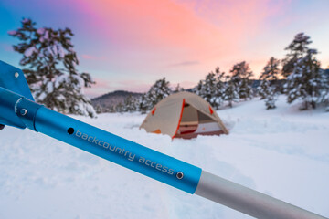 Backcountry Shovel and Tent in Snow