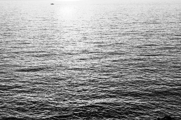 Obraz premium Gray sea background, close-up. A backing with sea waves texture for branding, calendar, postcard, screensaver, wallpaper, poster, banner, cover, website. Toned high quality photo