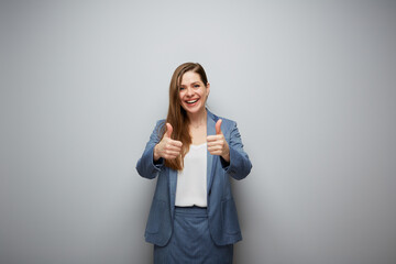 Happy business woman showing thumbs up.