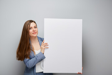 Smiling business woman holding white sign board.
