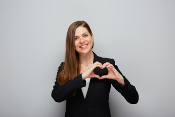 Smiling business woman doing heart shape figure with fingers Isolated portrait.