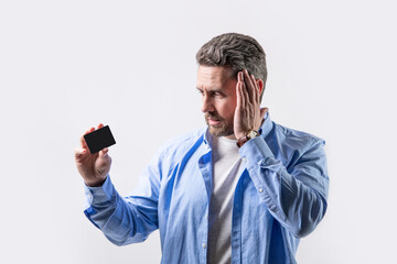 surprised guy holding business credit. photo of guy hold business credit.