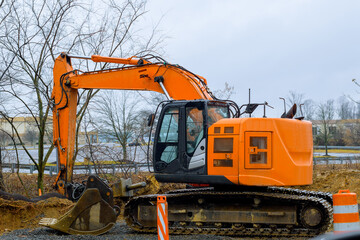 destruction of the road surface on an intercity highway using an excavator to replace it