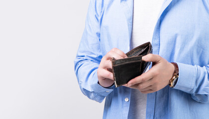 closeup of broke man with wallet isolated on studio background. broke man with wallet