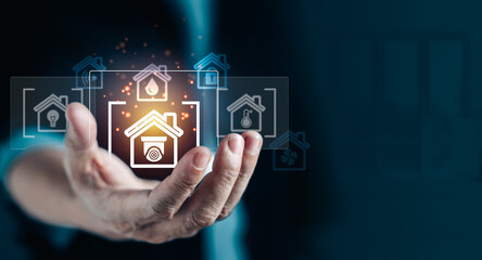 Hand of man holding virtual icons on display screen as a assistant remote from house.