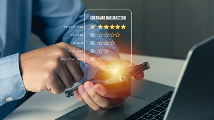 Customer satisfaction, business using smartphone to feedback service or survey concept, 5 stars satisfaction.