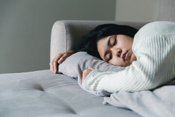 Concept of sad teenage girl depression. Upset teenage girl sitting at window indoors. Anxiety young woman Despair and stress. Lonely and unhappy female are social victims. loneliness youth in home.