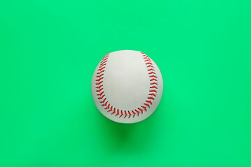 Baseball ball on green background, top view. Sports game