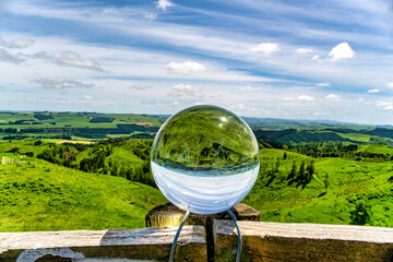 The rural farming agricultural countryside refracted upside down in the Crystal ball