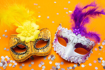 colorful carnival masks  on an orange background