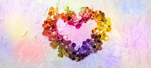 Heart from golden confetti on coating putty with pearlescent paint  with uneven coating with silver...