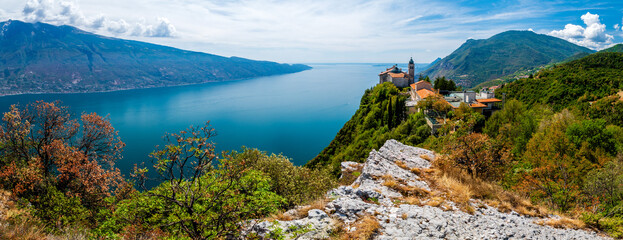 Lake Garda (Lago di Garda) with famous Pilgrimage church Madonna di Montecastello in the mountains...