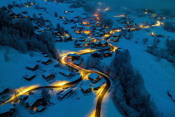 Aerial view of Grindelwald at night in winter, Switzerland.