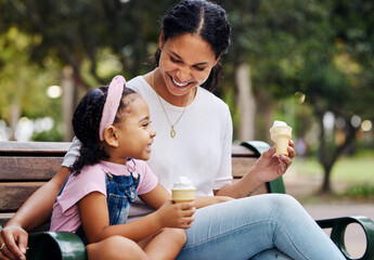 Summer, park and ice cream with a mother and daughter bonding together while sitting on a bench...