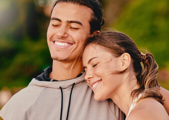 Obraz premium Happy couple, smile and hug embracing relationship and spending quality time together in the outdoors. Man and woman relaxing and smiling for holiday break, fresh air and satisfaction in nature