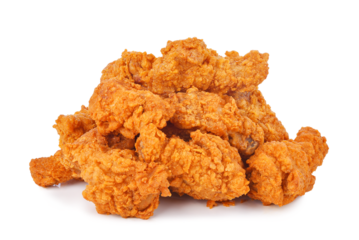 Heap of fried spicy chicken isolated on transparent background. PNG