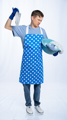 man in blue apron, rubber gloves, blue t-shirt, jeans. the homeowner holds a basin with dirty...