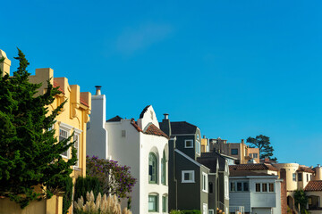 Fototapeta premium Row of modern decorative houses in the historic districts of san francisco california downtown in afternoon sun