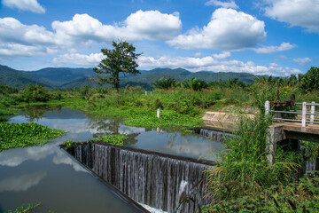 Water flowing over a weir on the Pang Sawan Weir, Uthai thani province, Thailand.