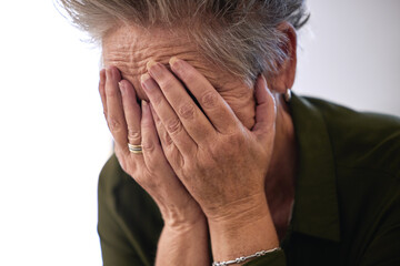 Fototapeta premium Senior woman, cover face with hands and sad for diagnosis, mental health and shocking news. Mature female, elderly lady and emotional with stress, depression and results for fatal illness or sickness