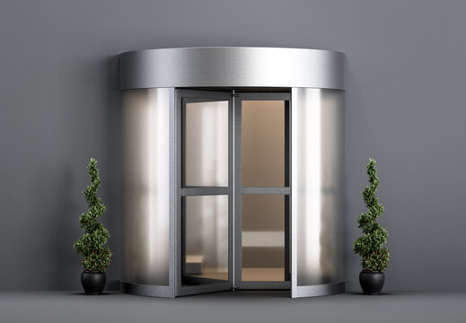 A Glass Revolving Door Used In Modern Mall, Office Or Skyscraper Entrance With Plants Front Of It. 3d Rendering