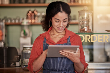 Small business, cafe barista and woman with tablet to manage orders, inventory and stock check. Coffee shop waiter, technology and happy young female waitress with touchscreen for managing sales. - obrazy, fototapety, plakaty